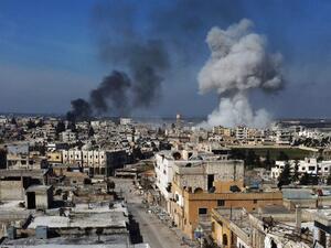 Smoke billows over the town of Saraqib in the eastern part of the Idlib province in northwestern Syria, following bombardment by Syrian government forces, on February 27, 2020. Syrian rebels reentered the key northwestern crossroads town of Saraqib lost to government forces earlier this month but fierce fighting raged on in its outskirts today, an AFP correspondent reported. Aref TAMMAWI / AFP