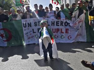 Algerian demonstrators wave the national flag during a demonstration in the capital Algiers, on February 28, 2020. Mass protests erupted in Algeria a year ago last Saturday, in response to President Abdelaziz Bouteflika announcing he intended to run for a fifth term after 20 years in power -- despite being debilitated by a 2013 stroke. RYAD KRAMDI / AFP