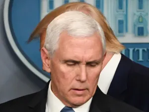 US President Donald Trump walks past US Vice President Mike Pence (L) during a press conference on the COVID-19, coronavirus, outbreak at the White House in Washington, DC on February 29, 2020. The number of novel coronavirus cases in the world rose to 85,919, including 2,941 deaths, across 61 countries and territories by 1700 GMT on Saturday, according to a report gathered by AFP from official sources. Roberto SCHMIDT / AFP