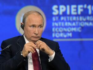 In this file photo taken on June 07, 2019 Russian President Vladimir Putin attends a plenary session of the St. Petersburg International Economic Forum (SPIEF) in Saint Petersburg. Russia will not hold its main business showcase, the Saint Petersburg International Economic Forum, in June due to the novel coronavirus outbreak, the head of its organising committee said on March 5, quoted by Russian news agencies. Olga MALTSEVA / AFP