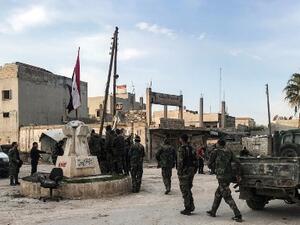Syrian army soldiers gather with vehicles in a square in the town of Saraqib in the northwestern Idlib province on March 6, 2020, as government forces assumed control over it. AFP