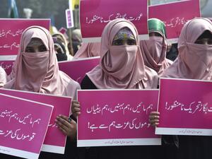 Supporters of the Pakistani Islamic political party Jamaat-e-Islami (JI) hold placards as they march during a rally to mark the International Women's Day in Lahore on March 8, 2020. Demonstrators were gathering for rallies across Pakistan on March 8 to mark International Women's Day in an ultra-conservative society where women are still put to death under ancient "honour" codes. ARIF ALI / AFP