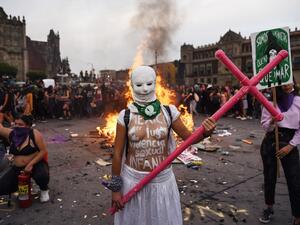 A woman poses for a photo while taking part in a protest during the International Women's Day, in Mexico City, on March 8, 2020. Women around the globe are taking action to mark International Women's Day and to push for action to obtain equality. VICTORIA RAZO / AFP