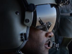 In this file photo taken on August 11, 2014, a US soldier, part of the NATO-led International Security Assistance Force (ISAF), looks out onboard a Chinook helicopter over the Gardez district of Paktia province. American forces have started pulling out of two bases in Afghanistan, a US official said on March 10, the day peace talks between Kabul and the Taliban were due to start despite widespread violence and a political crisis. The United States is keen to end its longest-ever conflict, and under the term