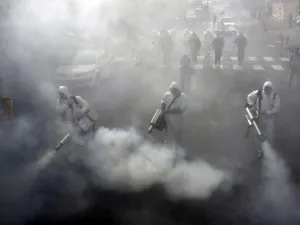 Iranian Firefighters disinfect streets in the capital Tehran in a bid to halt the wild spread of coronavirus on March 13 2020. Iranian forces will clear the streets nationwide within 24 hours and all citizens will be checked for the new coronavirus in a bid to halt its spread, the military said. AFP