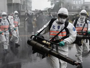 Soldiers from the military’s chemical units take part in a drill organised by the New Taipei City government to prevent the spread of the COVID-19 coronavirus, in Xindian district on March 14, 2020. Over 450 medical staff, community volunteers, government employees and military personnel took part in the drill. Despite being so close to the original outbreak in mainland China, Taiwan has just 48 confirmed cases of the Covid-19 disease with one death.  Sam Yeh / AFP