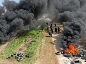Syrians protest and burn tyres in an attempt to block traffic on the M4 highway, which links the northern Syrian provinces of Aleppo and Latakia, before incoming joint Turkish and Russian military patrols (as per an earlier agreed upon ceasefire deal) in the village of al-Nayrab, about 14 kilometres southeast of the city of Idlib and seven kilometres west of Saraqib in northwestern Syria on March 15, 2020. Russian President Vladimir Putin and his Turkish counterpart Recep Tayyip Erdogan reached a deal on Ma