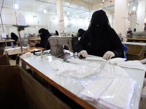 Yemeni women make face masks at a textile factory in the capital Sanaa on March 16, 2020. More than a decade after it shut down, 20 women have brought back to life Yemen's oldest industrial factory to manufacture what could save many lives amid a global pandemic: masks. Mohammed HUWAIS / AFP