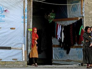 Syrian refugees are picture in a building under construction they have been using as a shelter in the city of Sidon in southern Lebanon, on March 17, 2020 amidst the coronavirus COVID-19 epidemic. AFP/File