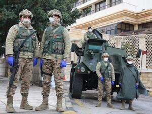 Jordanian soldiers keep watch on March 18, 2020 in the capital Amman as Jordan takes measures to fight the spread of the coronavirus COVID-19. Khalil MAZRAAWI / AFP