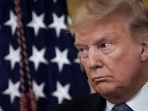 U.S. President Donald Trump look on during a ceremony to present the Presidential Medal of Freedom to retired four-star Army general Jack Keane in the East Room of the White House March 10, 2020 in Washington, DC. Gen. Keane currently works as an analyst on Fox News. Drew Angerer/Getty Images/AFP Drew Angerer / GETTY IMAGES NORTH AMERICA / AFP