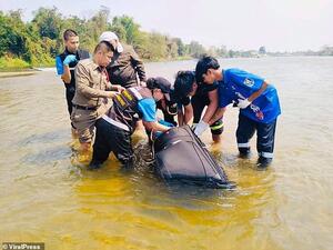 The body of Wang  Jun, 30, was found in this suitcase in the Ping river, Kamphaeng Phet, Thailand. Police divers are still searching for his wife Zhu Bing, 28, who is missing. (Viral Press)