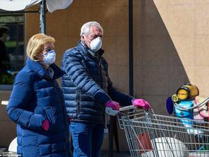 Residents of Milan sporting protective masks during a shopping trip last week after the country implemented a nationwide lockdown. AFP