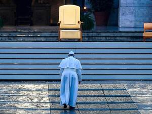Pope Francis walked alone up the stairs to St Peter's Basilica to deliver the extraordinary 'Urbi et Orbi' blessing (AFP)