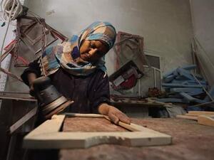 Amal Abu Rqayiq, a single mother, works at her small carpentry workshop in Nuseirat refugee camp in the Gaza Strip (Twitter)