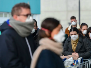 Residents wait to be given access to shop in a supermarket on February 23 in the small Italian town of Casalpusterlengo. Miguel Medina/AFP via Getty Images