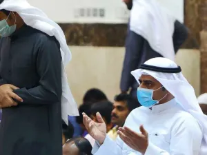 Worshippers wearing protective masks perform at a mosque in Kuwait City on February 28, 2020. (AFP)