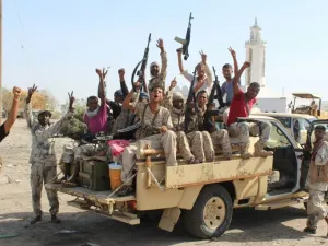 Forces loyal to the Saudi-backed Yemeni president cheer on a road in Abyan province as they take part in an operation to drive Al-Qaeda fighters out of the southern provincial capital, on April 23, 2016. (AFP)