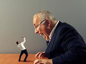 Trending footage shows a group of besuited men and women getting on all fours at a meeting venue in north-eastern China. (Shutterstock)
