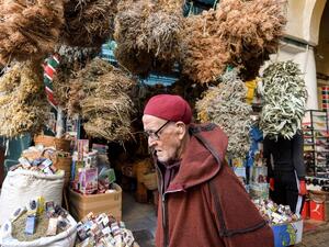 plants at Souk el-Blat, in the Medina (old city) of Tunisia's capital Tunis, on March 14, 2020. The herbalists' district of Souk el-Blat, in the heart of the old city of Tunis, recognisable by its aromatic scents and its stalls where vials, powders and bundles of various plants line up high, is a destination for people searching for traditional recipes against seasonal maladies, but now the attention is on COVID-19 novel coronavirus, for which no scientific remedy is yet known. FETHI BELAID / AFP