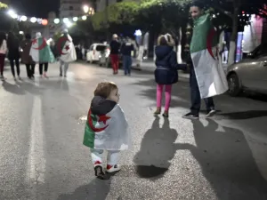 In this file photo taken on April 2, 2019, Algerians celebrate in the capital Algiers after the country's veteran President Abdelaziz Bouteflika informed the Constitutional Council that he was resigning. A year after the unexpected downfall of Algeria's longtime president Abdelaziz Bouteflika, the ailing octogenarian remains holed up in his medically adapted and upmarket home, with his detractors still demanding justice. RYAD KRAMDI / AFP