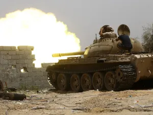 In this file photo taken on June 13, 2019, fighters loyal to the UN-recognised Government of National Accord (GNA) open tank fire from their position in the al-Sawani area south of the Libyan capital Tripoli during clashes with forces loyal to strongman Khalifa Haftar. AFP
