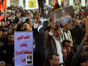 In this file photo taken on February 14, 2020, supporters of Libyan military strongman Khalifa Haftar (image) take part in a demonstration in the coastal city of Benghazi in eastern Libya, against Turkish intervention in the country's affairs. (AFP/File Photo)