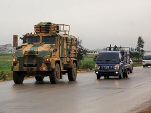 A Turkish military convoy drives on a highway linking Idlib to the Syrian Bab al-Hawa border crossing with Turkey on March 31, 2020. Mohammed AL-RIFAI / AFP