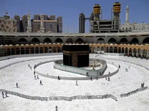 Muslim worshippers circumambulate the sacred Kaaba in Mecca's Grand Mosque, Islam's holiest site, on April 3, 2020. Saudi Arabia on April 2 extended curfew restrictions on Islam's two holiest cities to 24 hours to stem the spread of coronavirus as the number of deaths from the disease rose to 21. AFP
