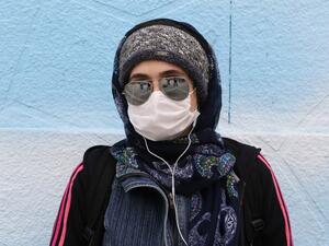 An Iranian woman wearing a protective mask poses for a picture in Tehran on April 13, 2020 during the coronavirus COVID-19 pandemic. The Islamic republic said on April 14 that the number of lives lost in the country to the novel coronavirus dropped to double figures for the first time in one month. Health ministry spokesman Kianoush Jahanpour said 98 deaths from the COVID-19 disease were recorded in the past 24 hours, bringing the overall toll to 4,683.  ATTA KENARE / AFP