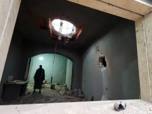 A Libyan man stands at the site of shelling on the residential area of Arada in the capital Tripoli on April 14, 2020. The forces of Libyan military strongman Khalifa Haftar rained rockets on Tripoli today after being ousted by government loyalists from a string of strategic towns west of the capital. The capture yesterday of the coastal towns of Sorman and Sabratha and smaller settlements further south was seen as a major blow to Haftar, who in April last year launched an offensive to seize Tripoli.  Mahmu