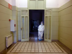A healthcare worker wearing a protective suit waits during a COVID-19 coronavirus testing campaign at the Hospital Sant Miquel care home for the elderly in Barcelona on April 15, 2020. Spain recorded 523 deaths from the coronavirus on Wednesday, a decline from the previous day, but the number of new daily confirmed cases was the highest in six days. LLUIS GENE / AFP