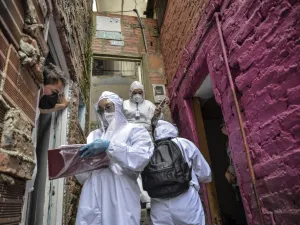 Workers of Bogota's Mayor's office wear protective suits to avoid getting infected with COVID-19 as they conduct a census at Egipto (Egypt) neighbourhood in Bogota on April 19, 2020 to know how many families need to be provided with food to prevent them from go shopping during the new coronavirus pandemic. The number of coronavirus infections across Latin America surpassed 100,000 on Sunday with nearly 5,000 deaths, according to an AFP tally based on official figures reported by individual countries. Diana 