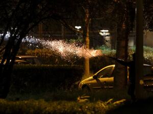 People fire fireworks during clashes in Villeneuve-la-Garenne, in the northern suburbs of Paris, on April 20, 2020. Tension with the police erupted again on the evening of April 20 in Villeneuve-la-Garenne near Paris, where a motorcycle accident involving the police had provoked the first clashes with residents two days before. GEOFFROY VAN DER HASSELT / AFP