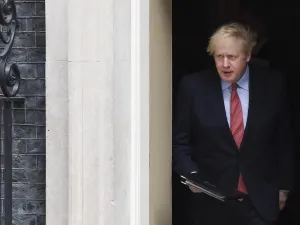 Britain's Prime Minister Boris Johnson walks out of 10 Downing Street to give a statement in central London on April 27, 2020 after returning to work following more than three weeks off after being hospitalised with the COVID-19 illness. (AFP)
