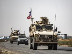 US military vehicles drive on a road after US forces pulled out of their Tal Tamr base in Northern Syrian on October 20, 2019 (PHOTO / SOULEIMAN / AFP)