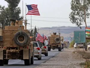 A convoy of US military vehicles arrives near the Iraqi Kurdish town of Bardarash in the Dohuk governorate after withdrawing from northern Syria on October 21. (AFP)