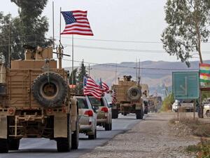 A convoy of US military vehicles arrives near the Iraqi Kurdish town of Bardarash in the Dohuk governorate after withdrawing from northern Syria on October 21. (AFP)