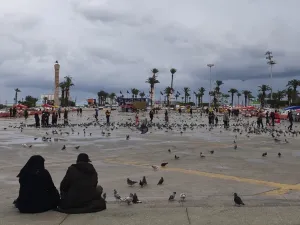 Libyans sit at Martyrs square in the capital Tripoli on March 10, 2020. According to Libyan authorities, not a single case of coronavirus so far has been recorded in the country which faces Italy across the Mediterranean. (AFP/File)