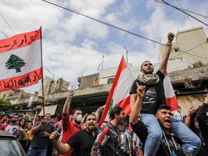 Protesters from across Lebanon gather for a demonstration outside the home of killed protester Fawwaz al-Samman -- who died after he was shot during riots in late April -- in the northern port city of Tripoli on May 3, 2020. Ibrahim CHALHOUB / AFP
