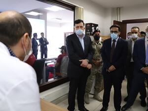 Fayez al-Sarraj (C), Prime Minister of Libya's UN-recognised Government of National Accord (GNA), visits the COVID-19 coronavirus response centre in the capital Tripoli on May 4, 2020. AFP