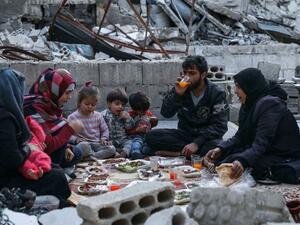This picture taken on May 4, 2020 during the Muslim holy fasting month of Ramadan shows members of the displaced Syrian family of Tareq Abu Ziad, from the town of Ariha in the southern countryside of the Idlib province. AAREF WATAD / AFP
