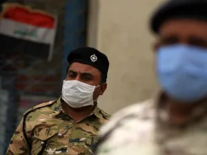 Members of the Iraqi security forces wearing a protective masks and gloves stand guard in the capital Baghdad's Tahrir square on May 5, 2020, during the novel coronavirus pandemic crisis. (AFP/File)