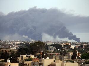 Smoke fumes rise above buildings in the Libyan capital Tripoli, during reported shelling by strongman Khalifa Haftar's forces, on May 9, 2020  Mahmud TURKIA / AFP