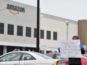 In this file photo taken on March 30, 2020 Amazon workers at Amazon's Staten Island warehouse strike in demand that the facility be shut down and cleaned after one staffer tested positive for the coronavirus in New York. (AFP)