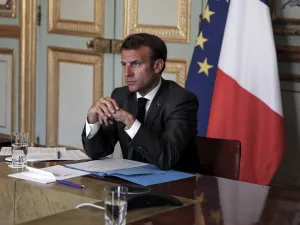 French President Emmanuel Macron listens to German Chancellor during a video conference to discuss a joint plan to spur the EU's recovery from the coronavirus crisis at the Elysee Palace on May 18, 2020, in Paris. (AFP/File)