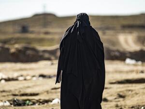 In this file photo taken on January 14, 2020 A French woman walks at the section reserved for foreigners, inside the Kurdish-run al-Hol camp for the displaced in the al-Hasakeh governorate in northeastern Syria.(AFP)