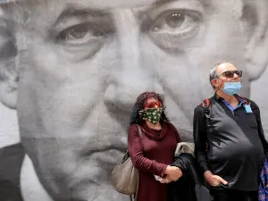Israeli protesters rally against Prime Minister Benjamin Netanyahu outside his residence in Jerusalem on May 24, 2020. The veteran premier, who has just forged a unity government after over a year of political turmoil, now faces the next challenge -- being the country's first premier to face criminal charges while in office. Netanyahu addressed reporters before entering the Jerusalem District Court where he was to face charges of bribery, fraud and breach of trust. He condemned the "fabricated and ludicrous