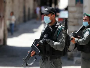 Member of the Israeli security forces patrol in the area where Israeli police in annexed east Jerusalem reportedly shot dead a Palestinian with special needs they mistakenly thought was armed with a pistol, on May 30, 2020. The incident happened in the alleys of the walled Old City near Lions' Gate, an access point mainly used by Palestinians. Ahmad GHARABLI / AFP