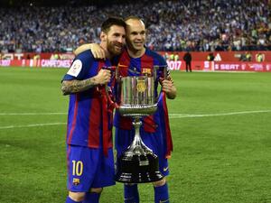 صورة أرشيفية لإنييستا وميسي